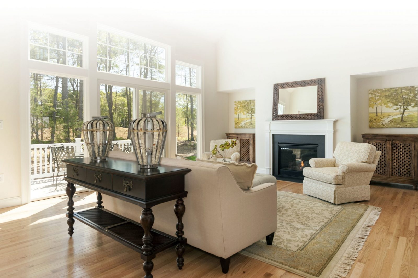 Sweeping ceilings showcase the natural light streaming through oversized windows in this great room at Duxbury Woods. An open floor plan allows this view from all angles as soon as you walk in the door. 
